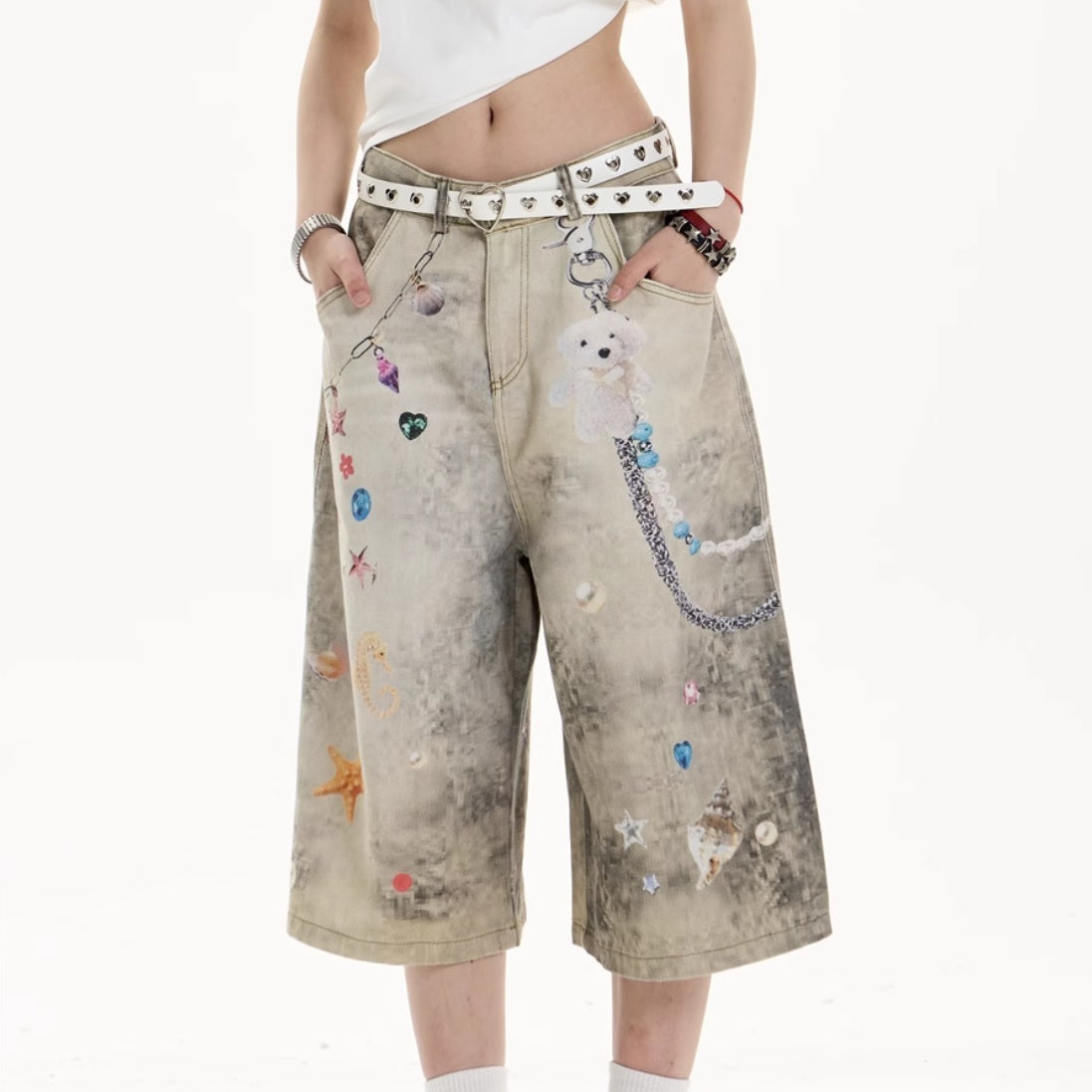Jeans de perna larga cortados criativos com arte impressa floresça
