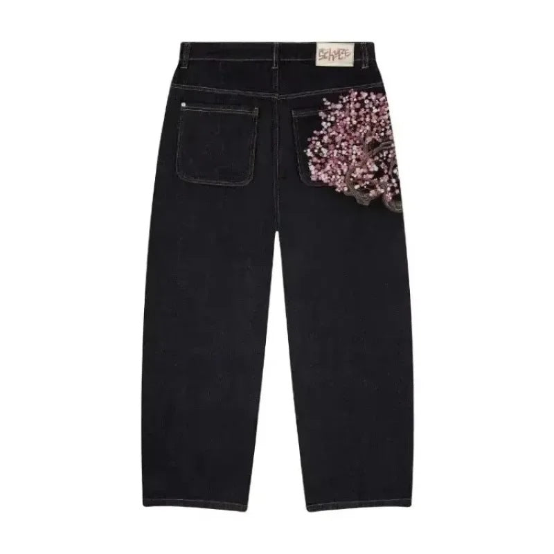 Jeans pinggang tinggi dengan pola sulaman mode