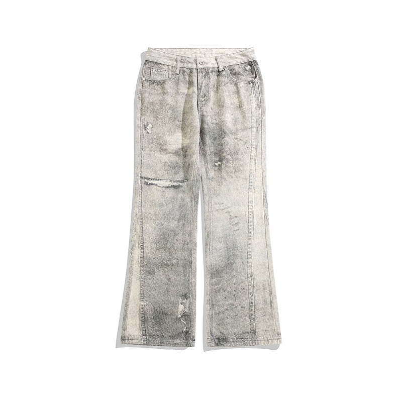 Tie-geverfde versleten jeans met lichte dweam en vintage gaten