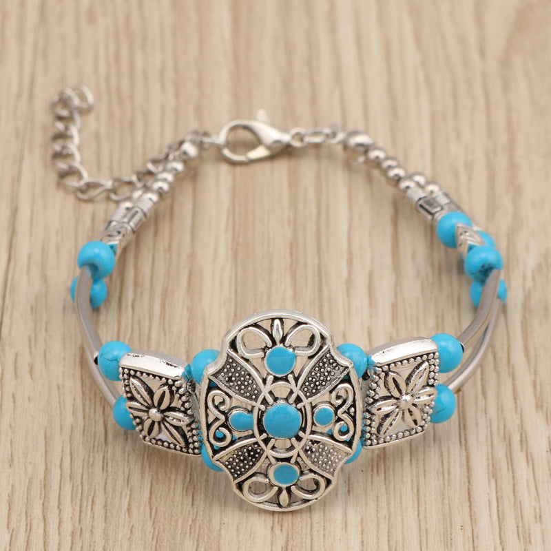 Kleurrijke metalen armband met bloemen