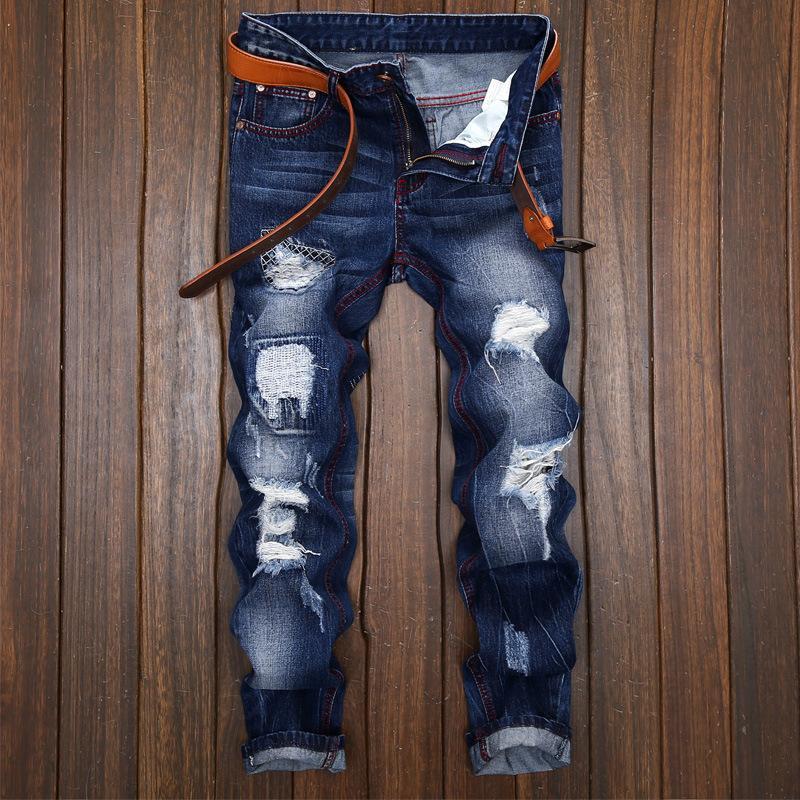 Jeans magri strappati con la cintura